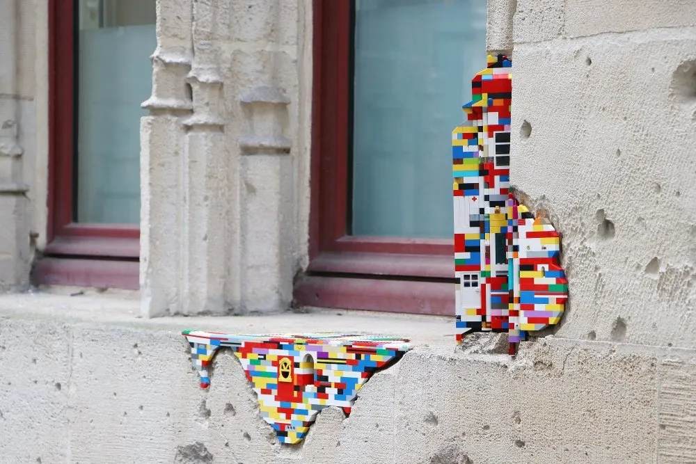A wall patched up with LEGO bricks.
